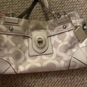 Cream colored COACH purse